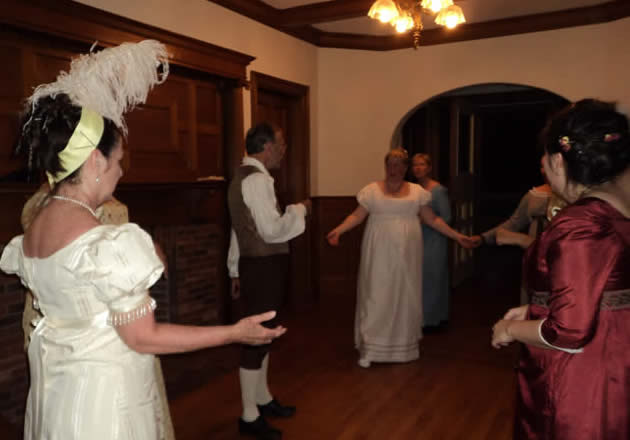 Costumed dancers in the front hall of The Governor's House