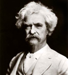 Bkack and white photograph of man (Mark Twain) with white hair and large moustache