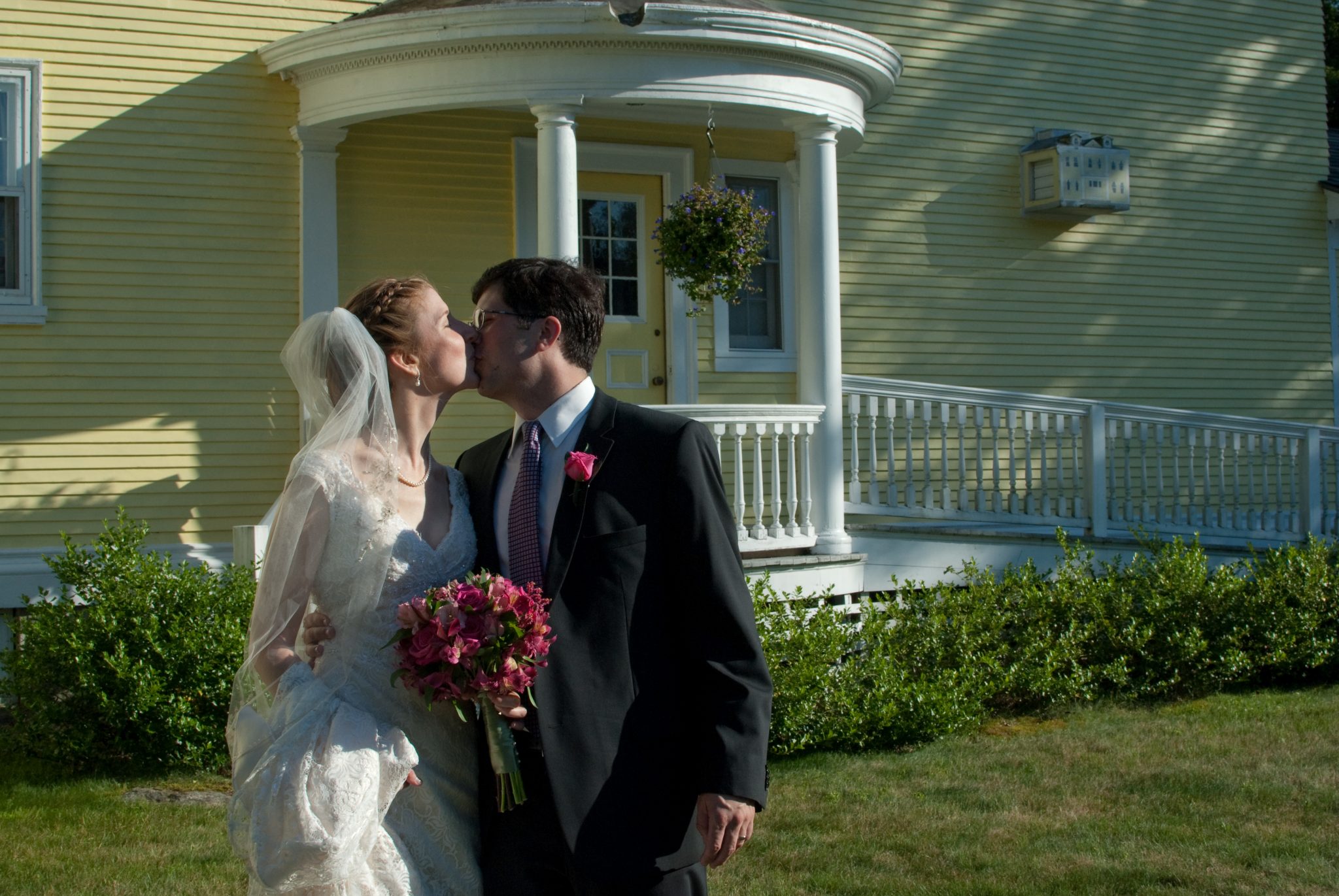 bride and groom kiss after their wedding at the Governor's House