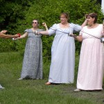ladies in Regency period dress have a beginners' fencing lesson