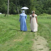 two ladies in Regency period costume taking a walk